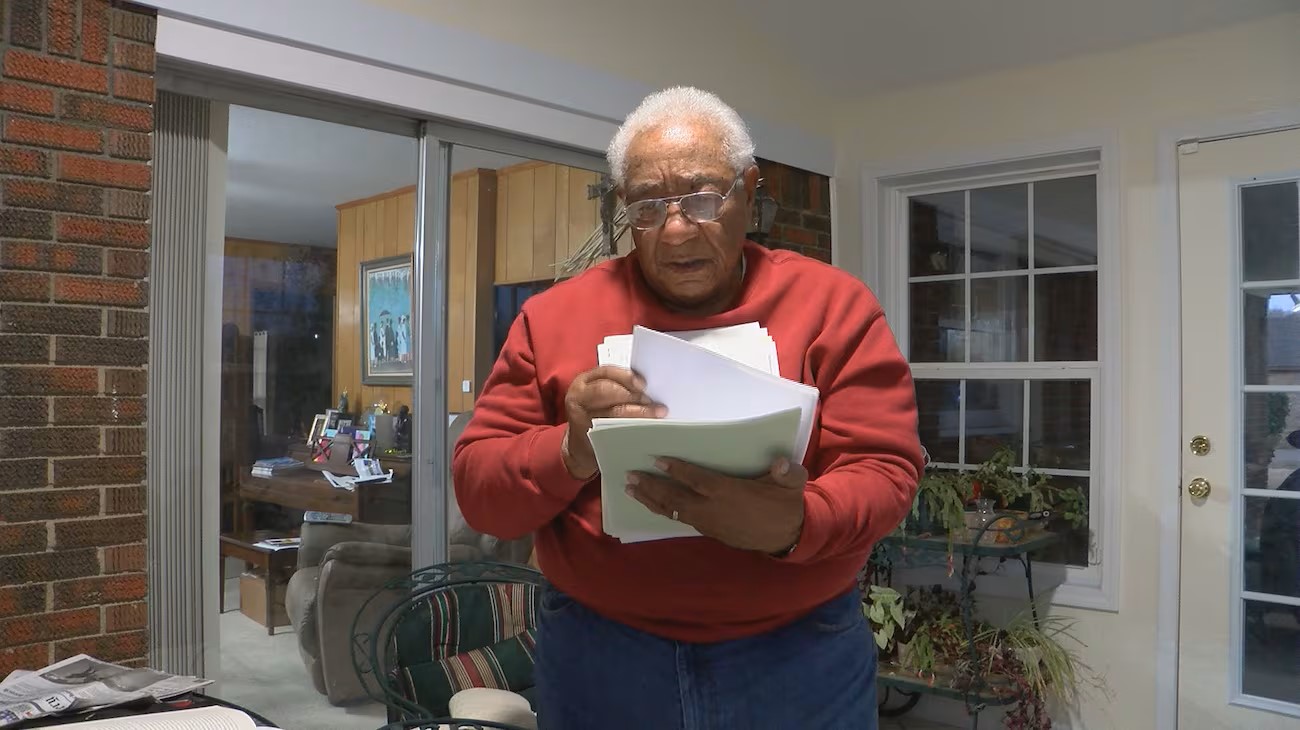 Crear flips through documents filled with information on his lineage Crear flips through documents filled with information on his lineage